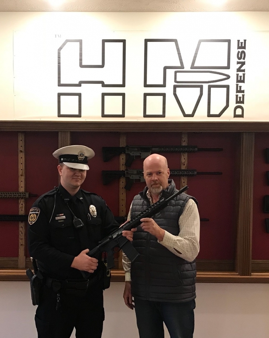 officer and man holding gun